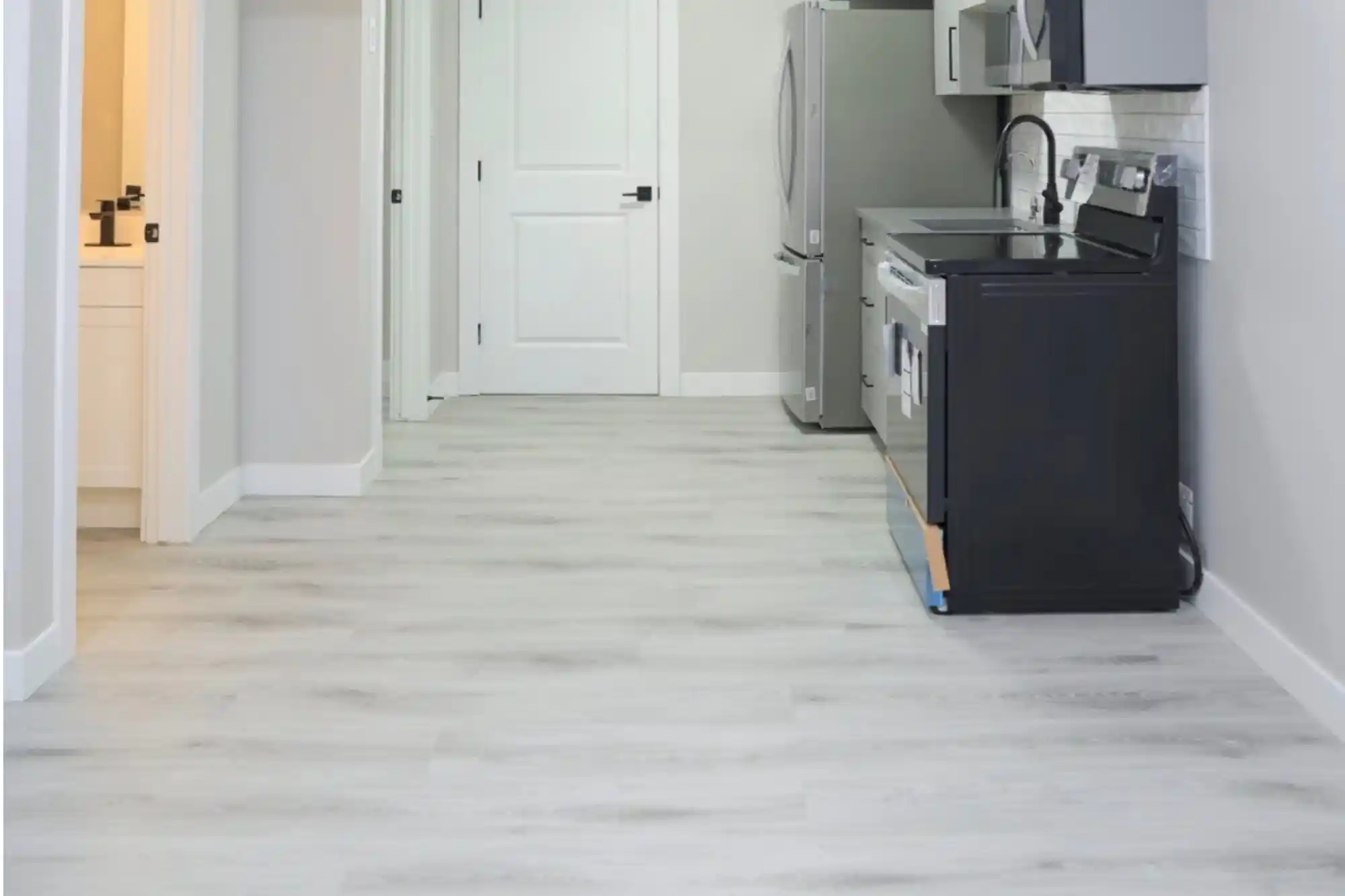Basement suite living area with kitchenette