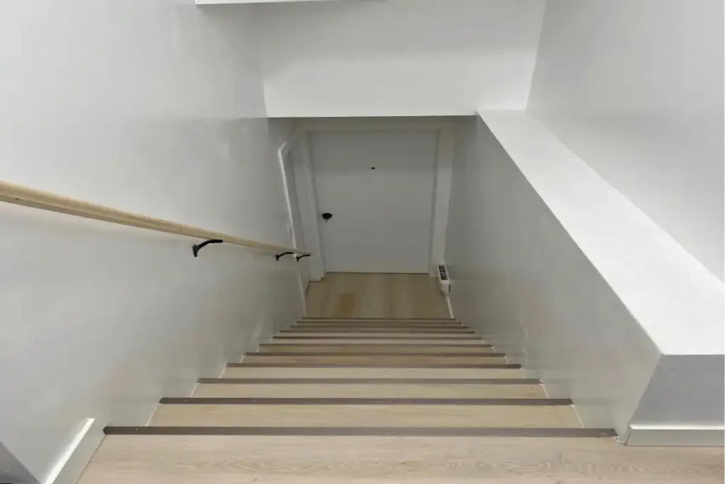 Stairway leading to a recently completed basement project